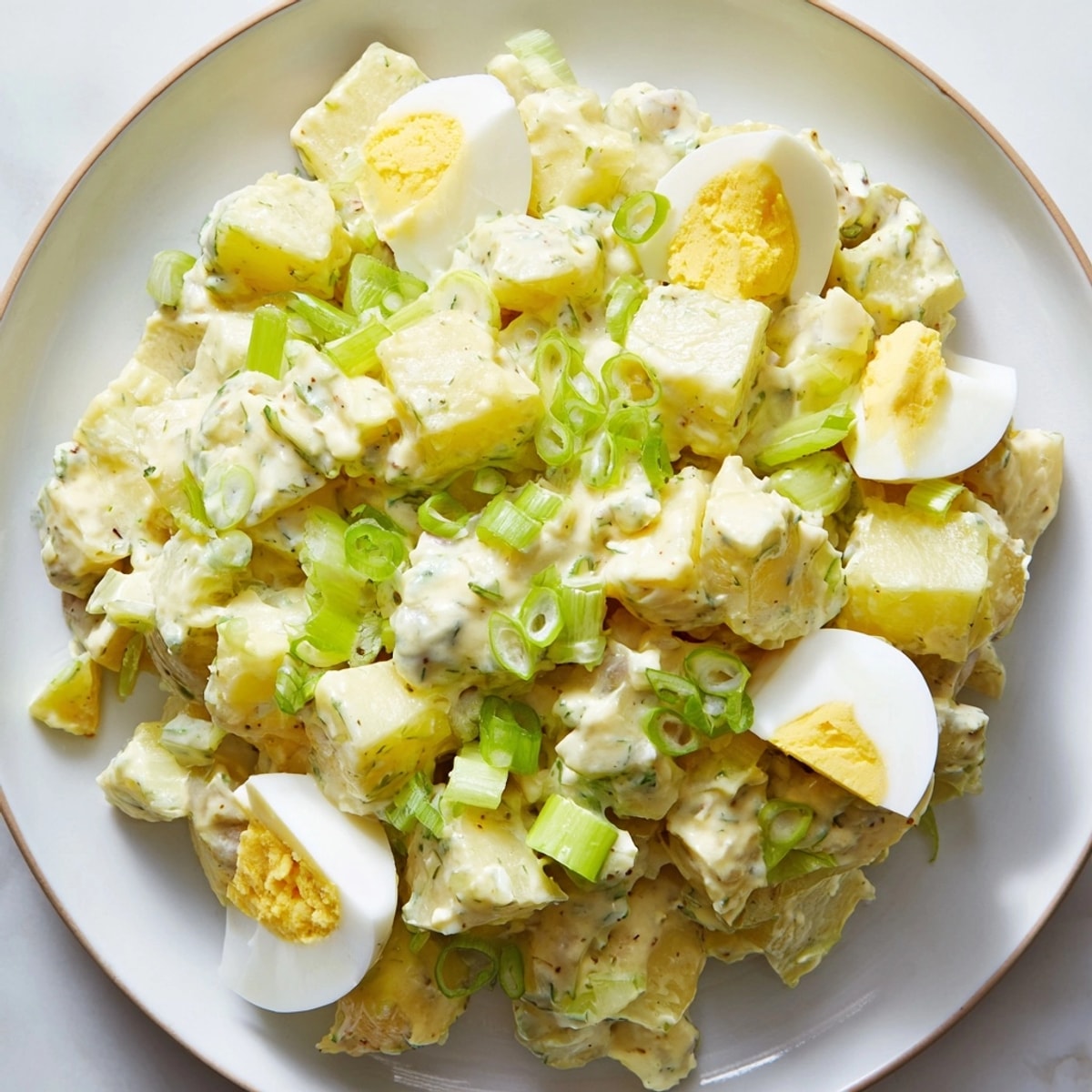 Classic potato salad: Creamy, tangy, and studded with celery for a delightful crunch.