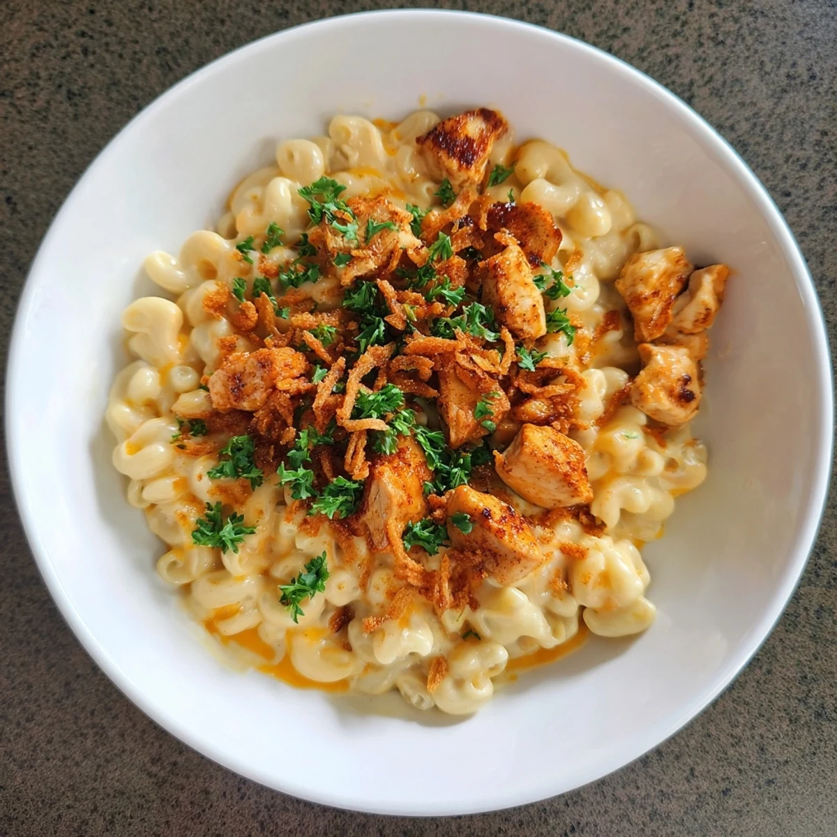 One-pot Honey BBQ Chicken Mac and Cheese, bubbling and cheesy, with tender chicken and crispy toppings.