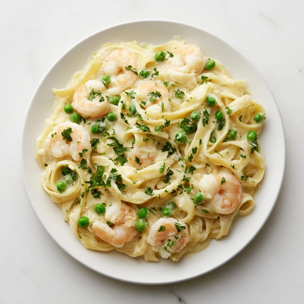 Instant Pot Shrimp Alfredo Pasta, creamy and decadent, plated and garnished with vibrant parsley.