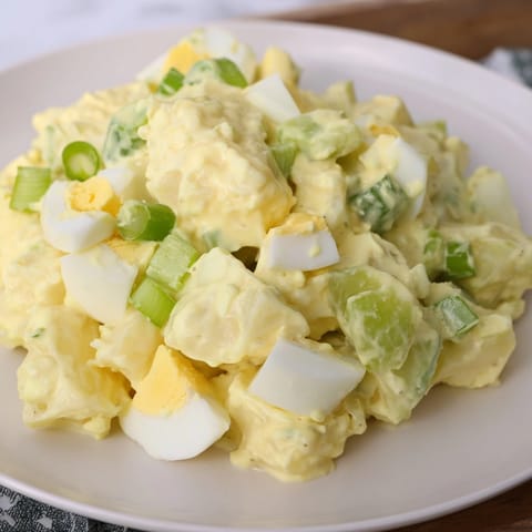 Homemade potato salad ready to be served, perfect for summer cookouts and picnics.