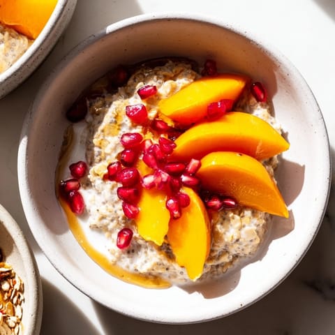 Sweet Overnight Oats feature layers of persimmon, pomegranate, and chia, perfect for a grab-and-go morning meal.