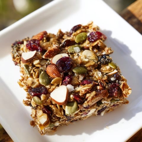 These homemade Roasted Pumpkin Seed & Cranberry Granola Bars are loaded with crunchy seeds and chewy cranberries.
