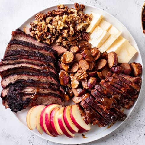This delicious Smoky BBQ & Bourbon Companion features tender brisket, rich cheeses, and candied pecans galore.