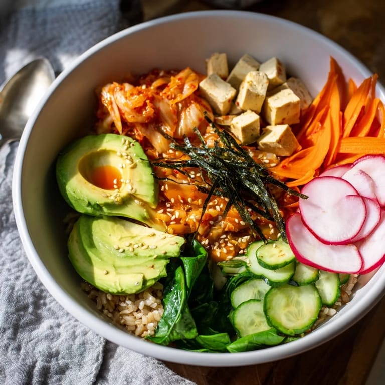 Vibrant fermented vegetable bowl showcasing kimchi, hearty grains, and crisp fresh veggies.  