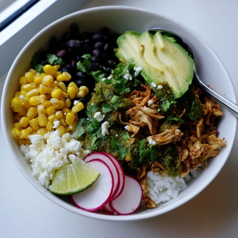 Fresh cilantro and lime complement this vibrant green enchiladas rice bowl.