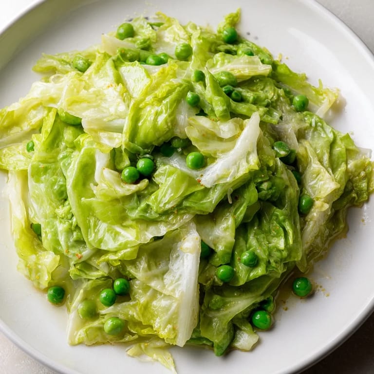 Ready in 20 minutes: a colorful Cabbage Stir-Fry with Garlic, Soy and peas, perfect with rice.