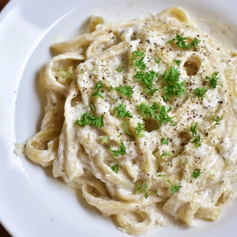 Hot, freshly made cottage cheese Alfredo sauce, perfect for a high-protein pasta dinner, is absolutely delicious.